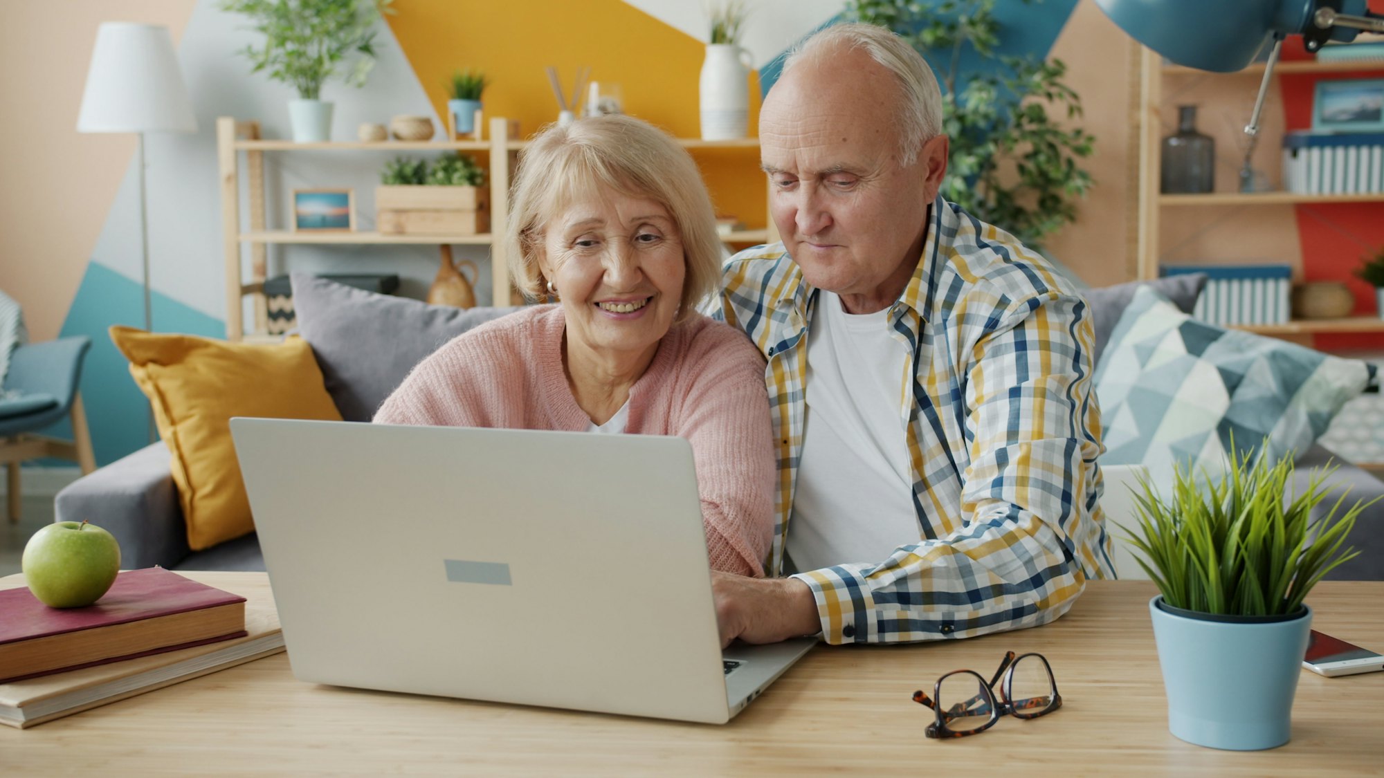 Couple reviewing their finances together on a laptop